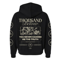 Black Thousand Below hoodie with "You never handed me the truth" and plant/geometric graphics on back; circular and triangular prints down both sleeves.