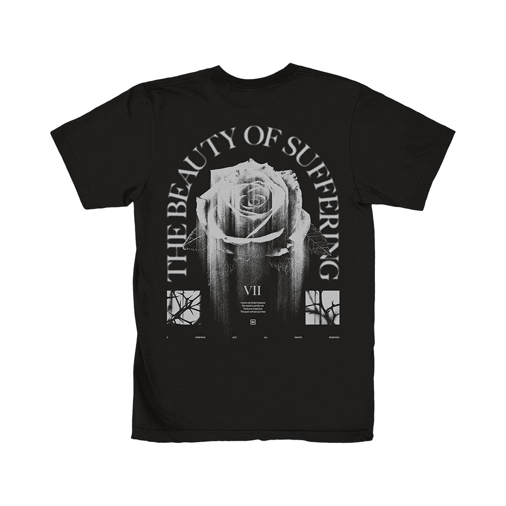 Spiritbox black T-shirt with a large distressed white rose on the back, “THE BEAUTY OF SUFFERING” arched above, window-style graphics below, and VII in the center. Perfect for fans of The Beauty Of Suffering.