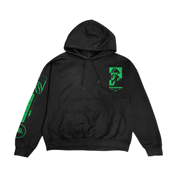 A black Thousand Below hoodie with neon green designs—featuring a face, geometric shapes, and text on the chest, sleeve, and above the pocket—crafted from heavyweight fabric and displayed against a black background.