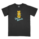 This black Saint Blonde t-shirt features a comfort colors design with a printed sad yellow bear holding a blue ball, sparkles, and “Saint Blonde” in light blue stylized letters below the illustration.