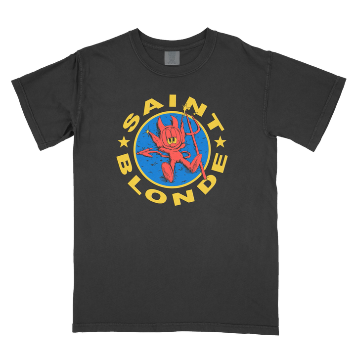 A black Saint Blonde t-shirt made of soft ring-spun cotton featuring a colorful red cartoon devil with a trident on a blue circle, yellow SAINT BLONDE text, and stars completing the design.