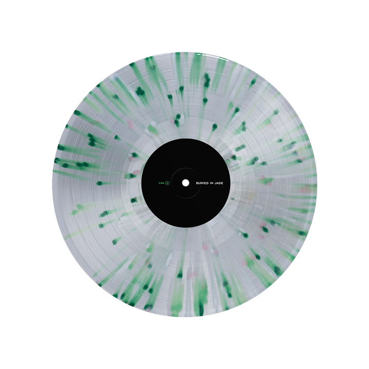A clear Splatter Vinyl LP from Thousand Below features green and black patterns radiating from the center and a black label with minimal white and green text. The Kerosene-hued vinyl is shown on a white background.