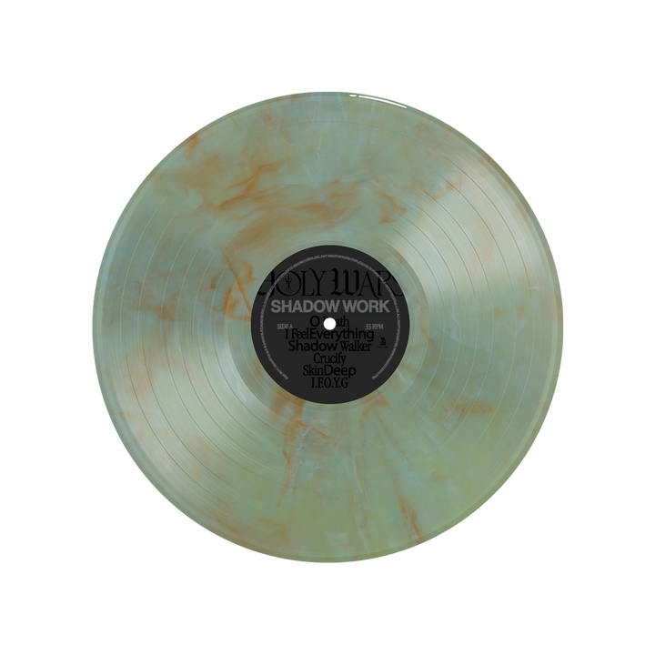 A translucent marbled vinyl by Holy Wars with green and orange swirls, titled Shadow Work/Light Work LP. Features track list and album info clearly printed on the black center label.