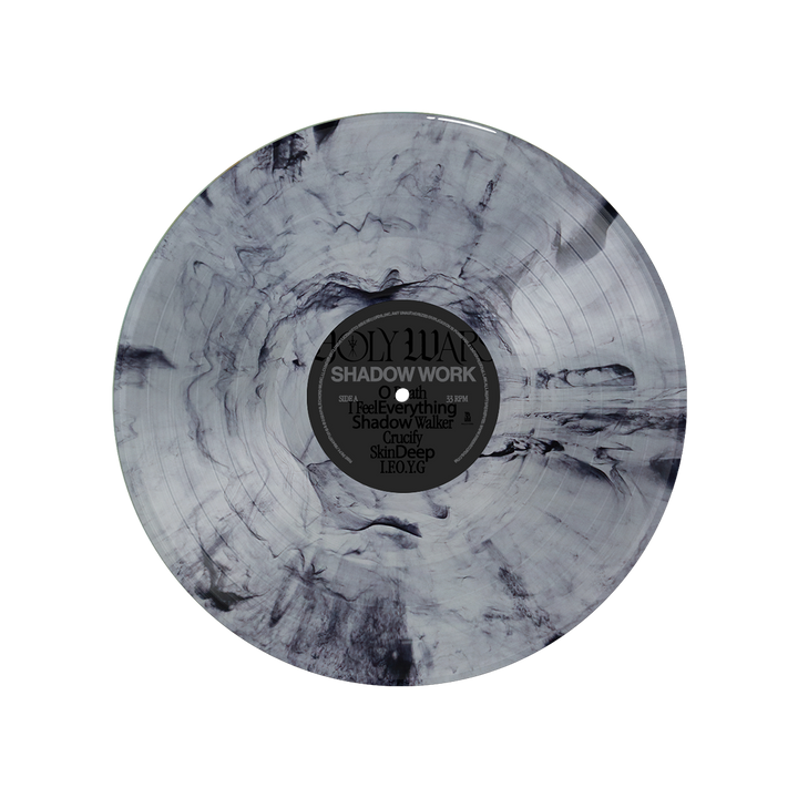 A limited edition marbled black and grey Holy Wars vinyl features the Shadow Work/Light Work LP. The label reads "Holy Wars - Shadow Work," with a white-on-black tracklist and a swirling, smoky pattern at the center.