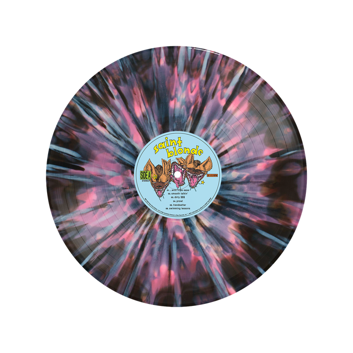 The Saint Blonde Starburst Vinyl LP showcases a marbled black, pink, and blue splatter with a light blue center label featuring cartoon wolf heads and song titles. Available now for presale.