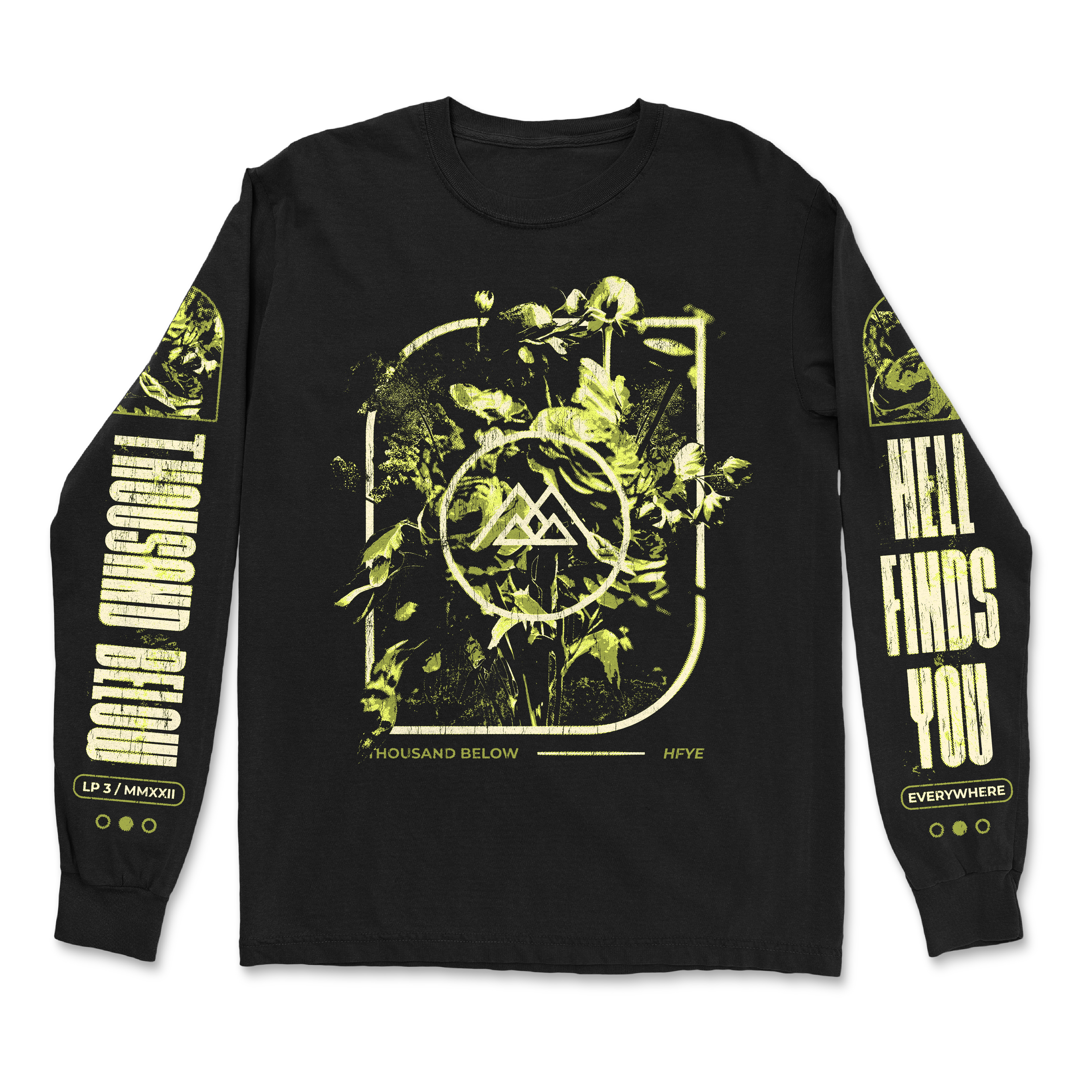 Black Gildan long-sleeve by Thousand Below with a classic fit, 100% cotton. Features green-yellow leafy plants and abstract symbols on the chest, sleeve text A Thousand Below and Hell Finds You, plus circular accents on the cuffs.