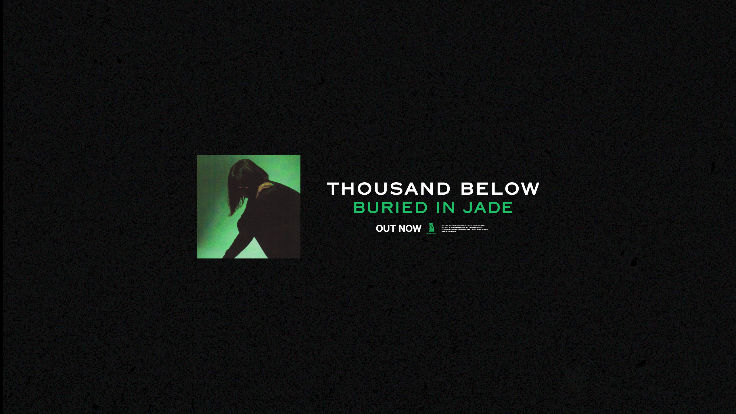 A dark image with a small photo of a person leaning forward against a green background. Text reads: THOUSAND BELOW BURIED IN JADE OUT NOW with a minimalist design.