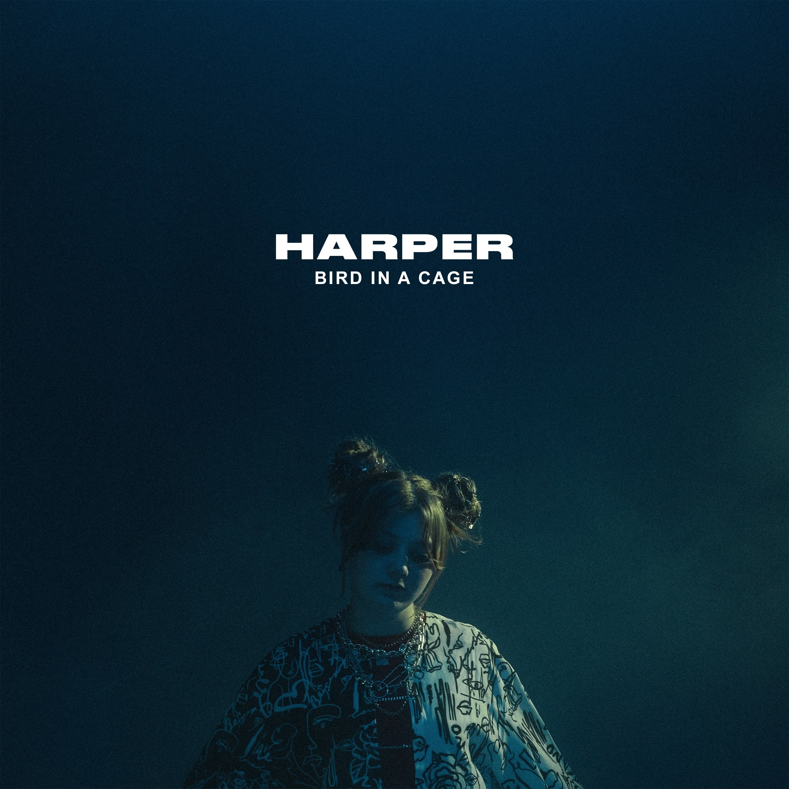 A person with two buns in their hair stands under moody blue lighting, wearing a patterned shirt. The text “HARPER” and “BIRD IN A CAGE” appears above them in bold white letters.