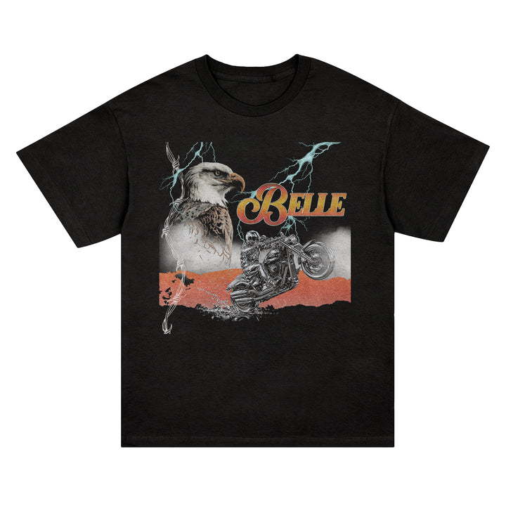 Black Comfort Colors t-shirt featuring a graphic of an eagle, a motorcyclist performing a wheelie, lightning bolts, and the word BELLE in a retro script font.
