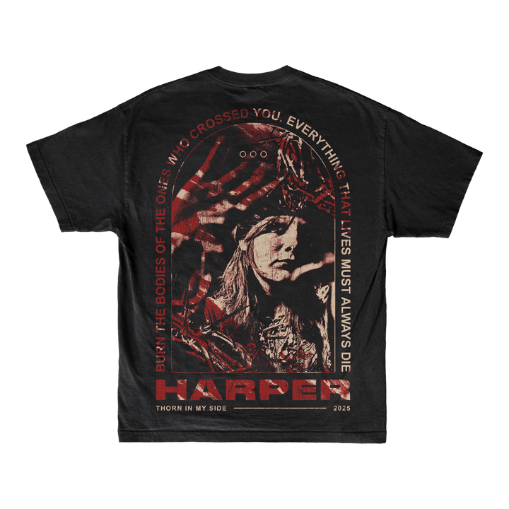 Harper relaxed-fit black T-shirt with a red-tinted graphic of a person in a headdress, bold surrounding text, “HARPER, THORN IN MY SIDE, 2025,” and made from soft ring-spun cotton.