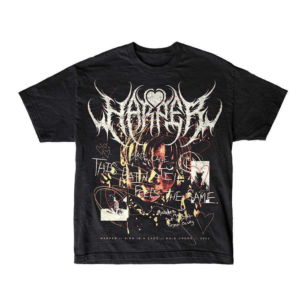 Harper's black Bird In A Cage T-Shirt showcases abstract, edgy graphics with distorted text, heart motifs, and artistic sketches. Handwritten phrases and doodles add a unique touch, while the main stylized text remains hard to read.