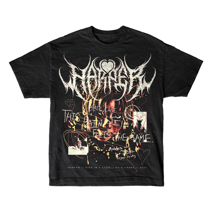 Harper men’s black graphic tee in soft ring-spun cotton, with chaotic white/red artwork, handwritten “THIS PAIN FEELS THE SAME.” text, hearts, and distorted faces. A heart sits above the main stylized print.