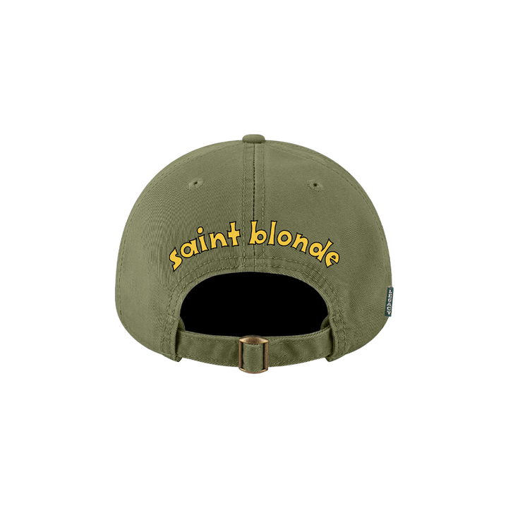 Saint Blonde Legacy hat in olive green, shown from the back with "saint blonde" embroidered in playful yellow lowercase lettering above the adjustable strap. Available now for presale.