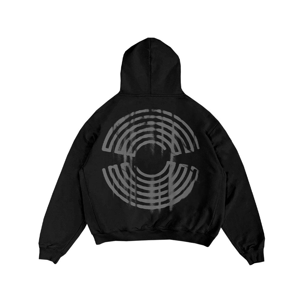 The Spiritbox Distortion Black Sweatshirt is a black zip-up hoodie with a large, circular gray geometric maze pattern of concentric arcs on the back.