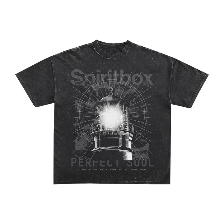 The Spiritbox Lighthouse T-Shirt in black mineral wash features a bold graphic of a glowing lighthouse with radiating lines, "Spiritbox" above, and "Perfect Soul" below in large letters.