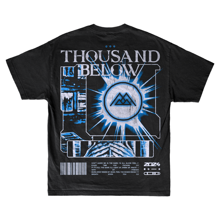 Black t-shirt by Thousand Below with bold logo, geometric blue and white digital graphics, central emblem, barcode, and futuristic details. Crafted from ring-spun cotton using OEKO-TEX certified dyes for comfort and safety.