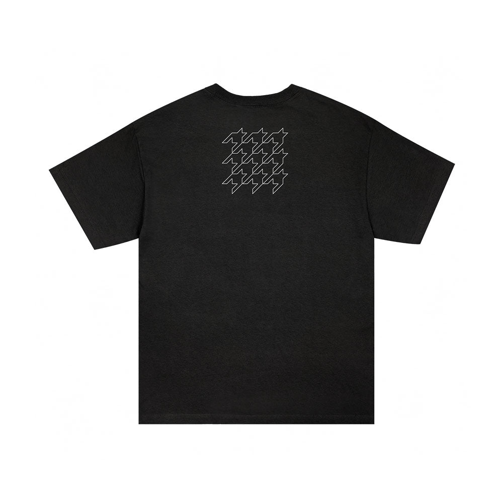 SIIICKBRAIN Manifestation Black T-Shirt features short sleeves and nine white abstract zigzag shapes in a grid on the upper back, standing out against a plain white background.