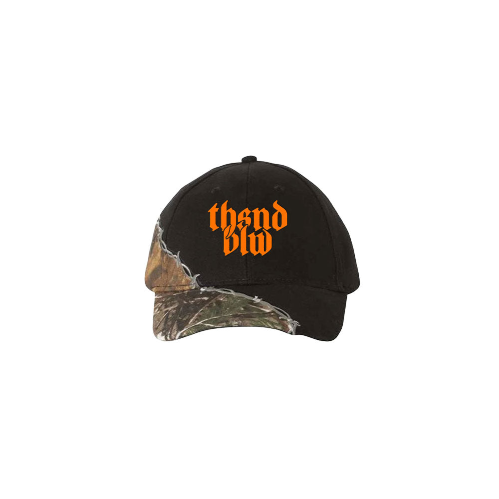 A black Thousand Below cap with camo accents on the brim and left, featuring bold orange gothic "th3nd blvd" text on the front.