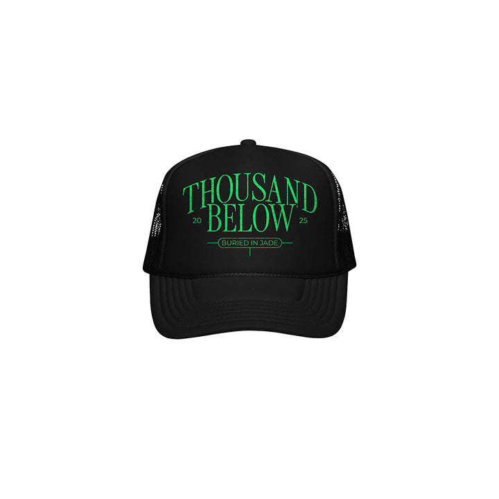 A black mesh band cap with Thousand Below 2025 in bold green text and Buried In Jade below, both centered on the front panel.