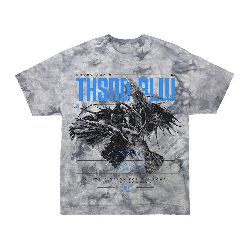 Thousand Below Gray Crystal Silver Dye T-Shirt with black wings graphic, blue "THSDN BLW" text, geometric designs, and detailed bottom featuring smaller text and social media icons.