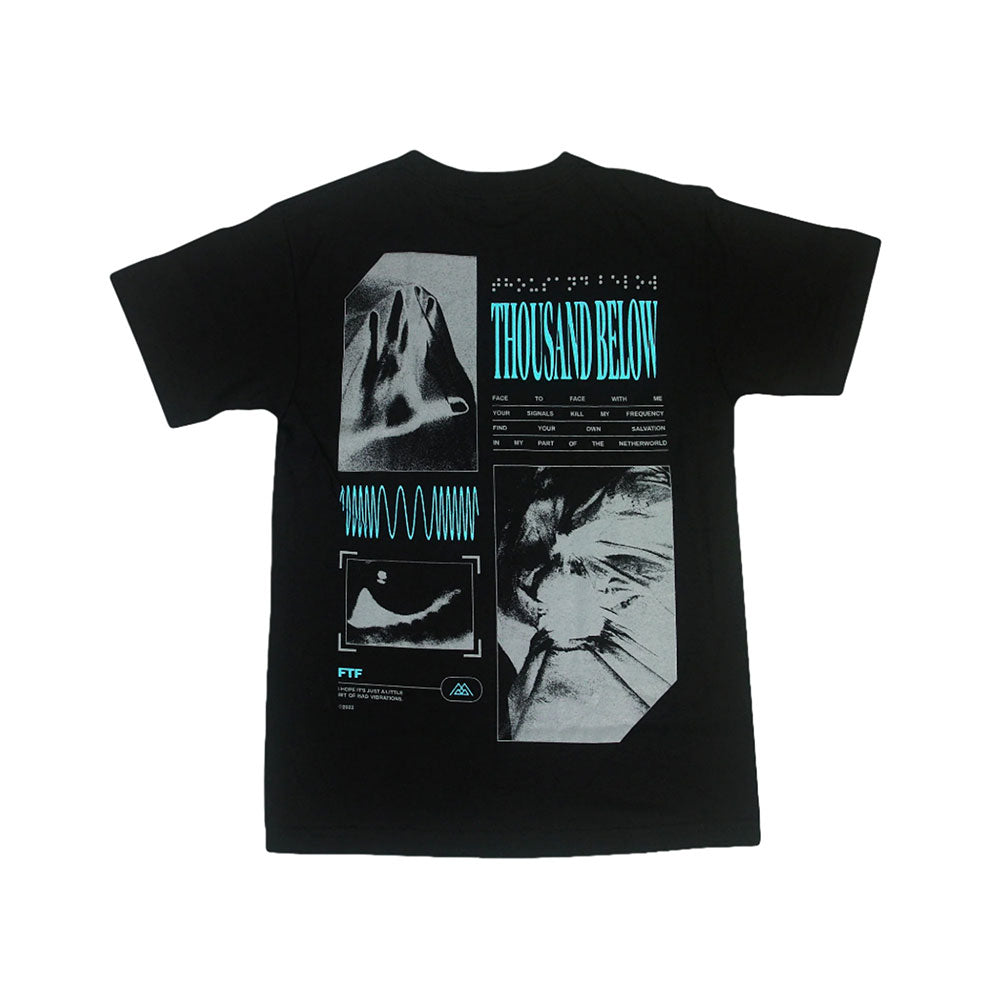 The Thousand Below Braille Black T-Shirt features abstract grayscale graphics, waveforms, and medical-style charts on the back, with large blue THOUSAND BELOW lettering across the center—a must-have for fans.