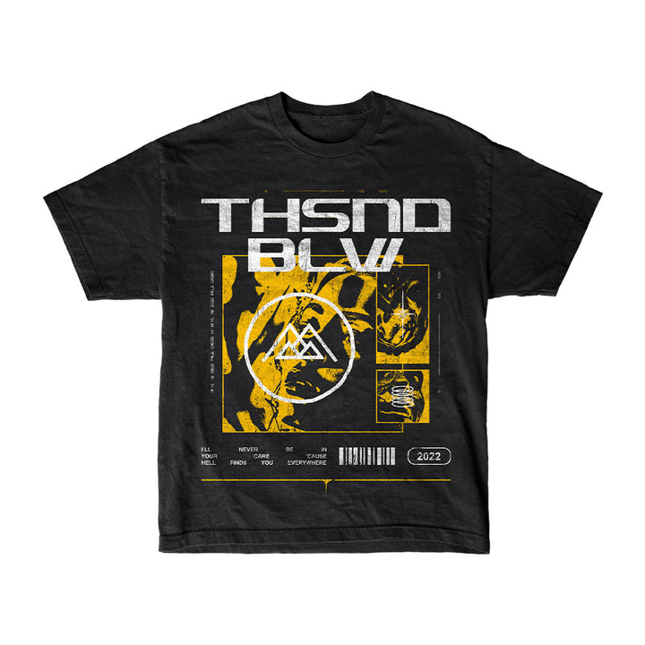 Thousand Below black T-shirt with bold white "THSND BLW" text above yellow and white abstract designs—geometric symbol, barcode, and "2022." Inspired by the band’s Hell Finds You Everywhere era.