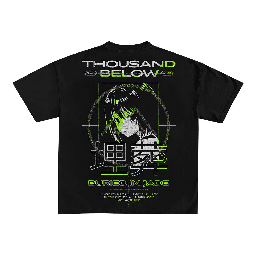 Thousand Below black anime shirt with green and white graphics of an anime-style girl’s face in a target frame, plus “THOUSAND BELOW,” “BURIED IN JADE,” and Japanese characters printed on the back.