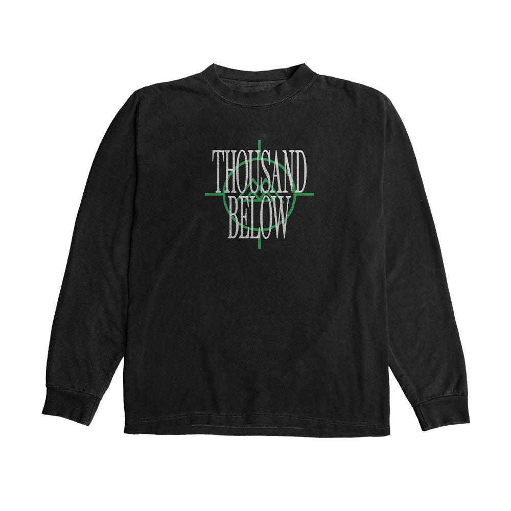 A black long sleeve shirt by Thousand Below featuring bold white uppercase text and a green horizontal line across the middle.