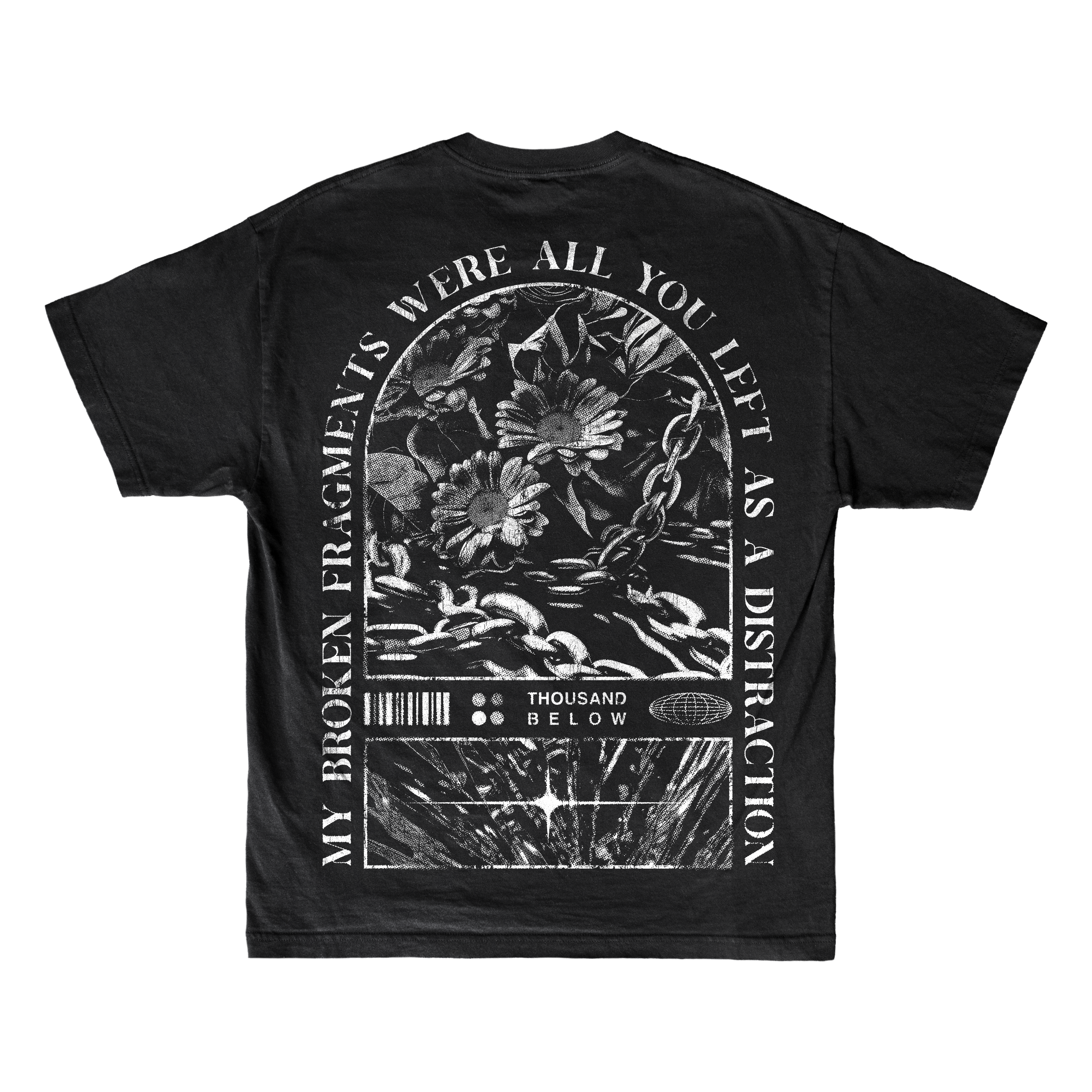 A black Thousand Below Gildan Softstyle T-Shirt with a gothic white graphic of flowers, chains, and text on the back. Made from ring-spun cotton for a modern classic fit and lasting comfort.