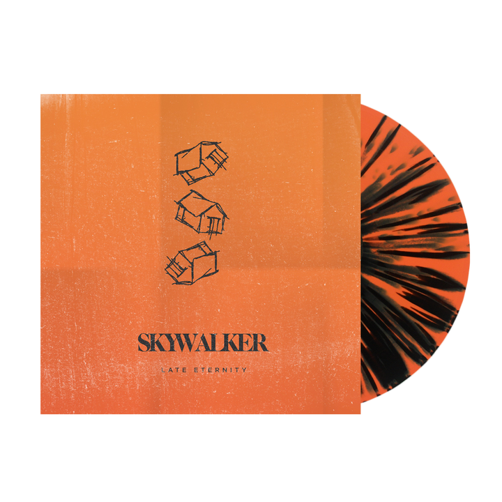 An orange vinyl record with black splatters is partially inside an orange Skywalker album cover, which displays three vertically stacked abstract cubes and the text SKYWALKER LATE ETERNITY at the bottom, inspired by Ignis.